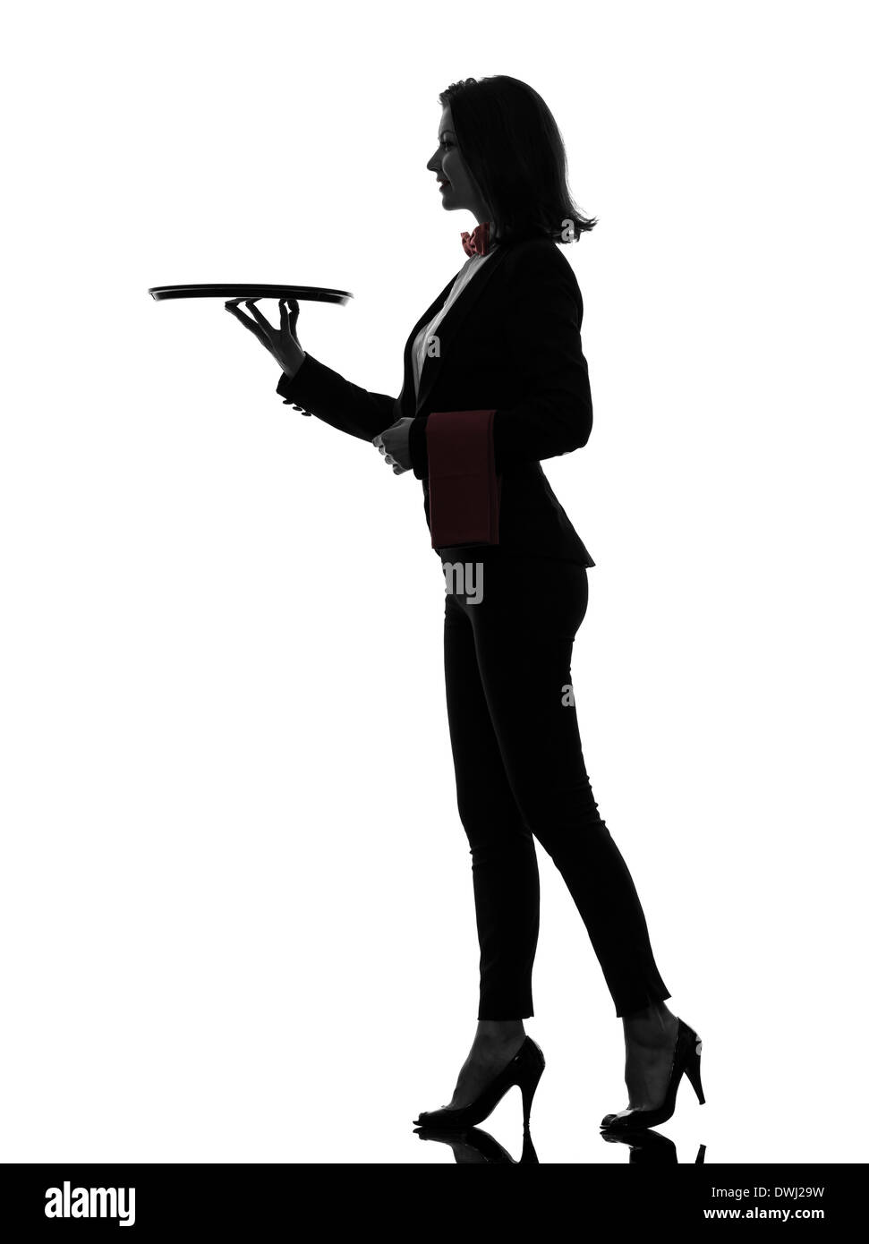 one  woman waiter butler holding empty tray in silhouette on white background Stock Photo