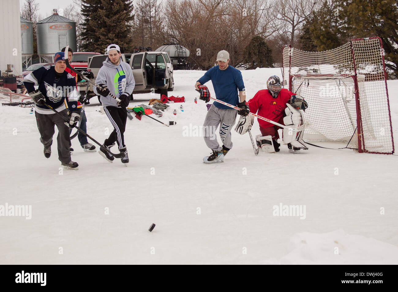 Outdoor Ice Hockey with friends. A friendly recreational game of hockey