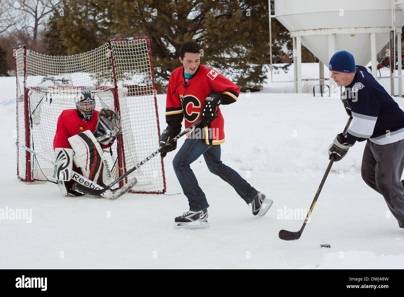 Outdoor Ice Hockey with friends. A friendly recreational game of hockey