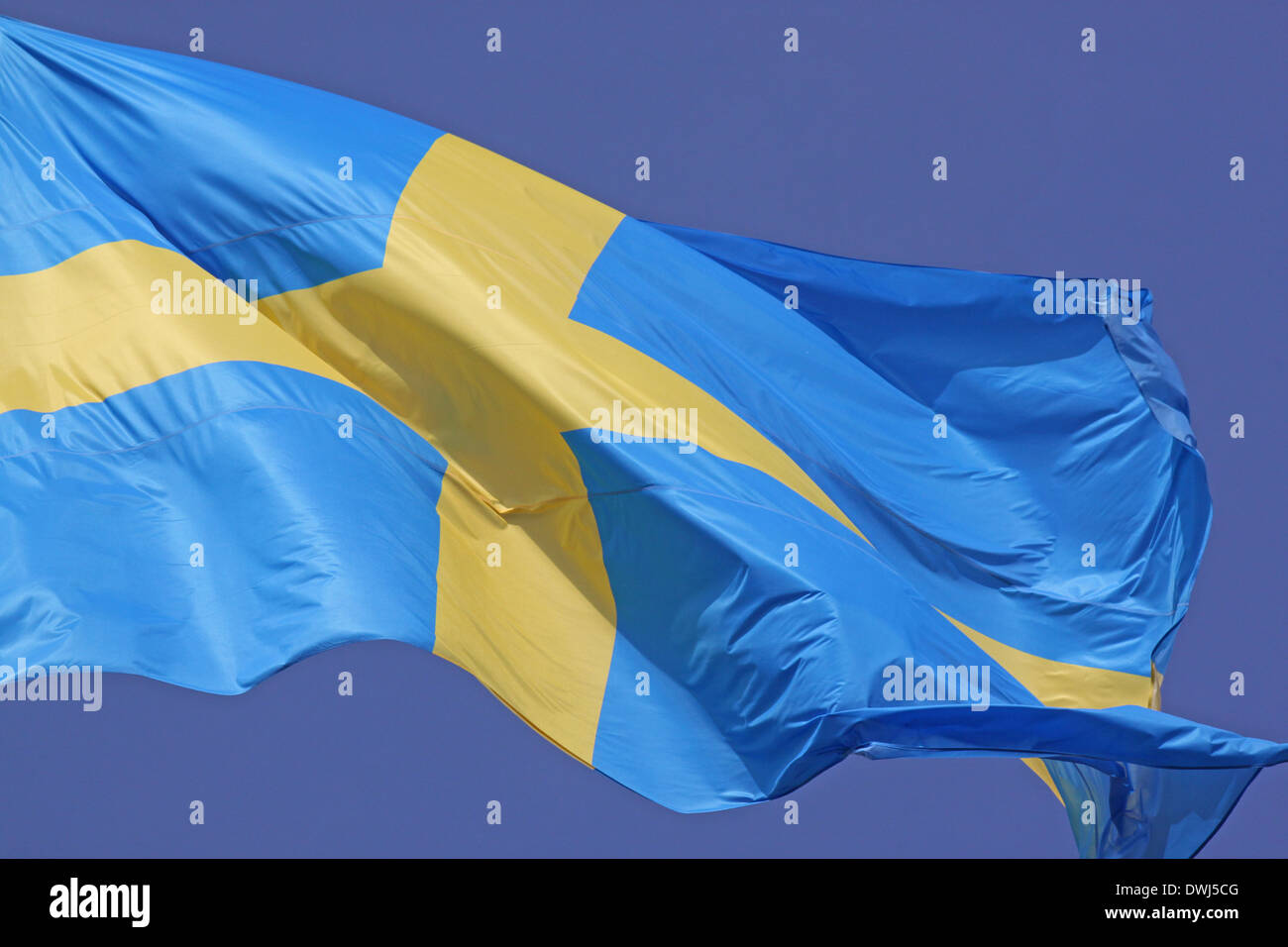 close up of Sweden flag over blue sky Stock Photo