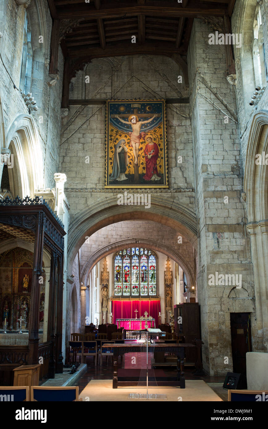 Altar and Stained Glass window interior of St John The Baptist Church, Burford, Cotswolds, Oxfordshire, England Stock Photo