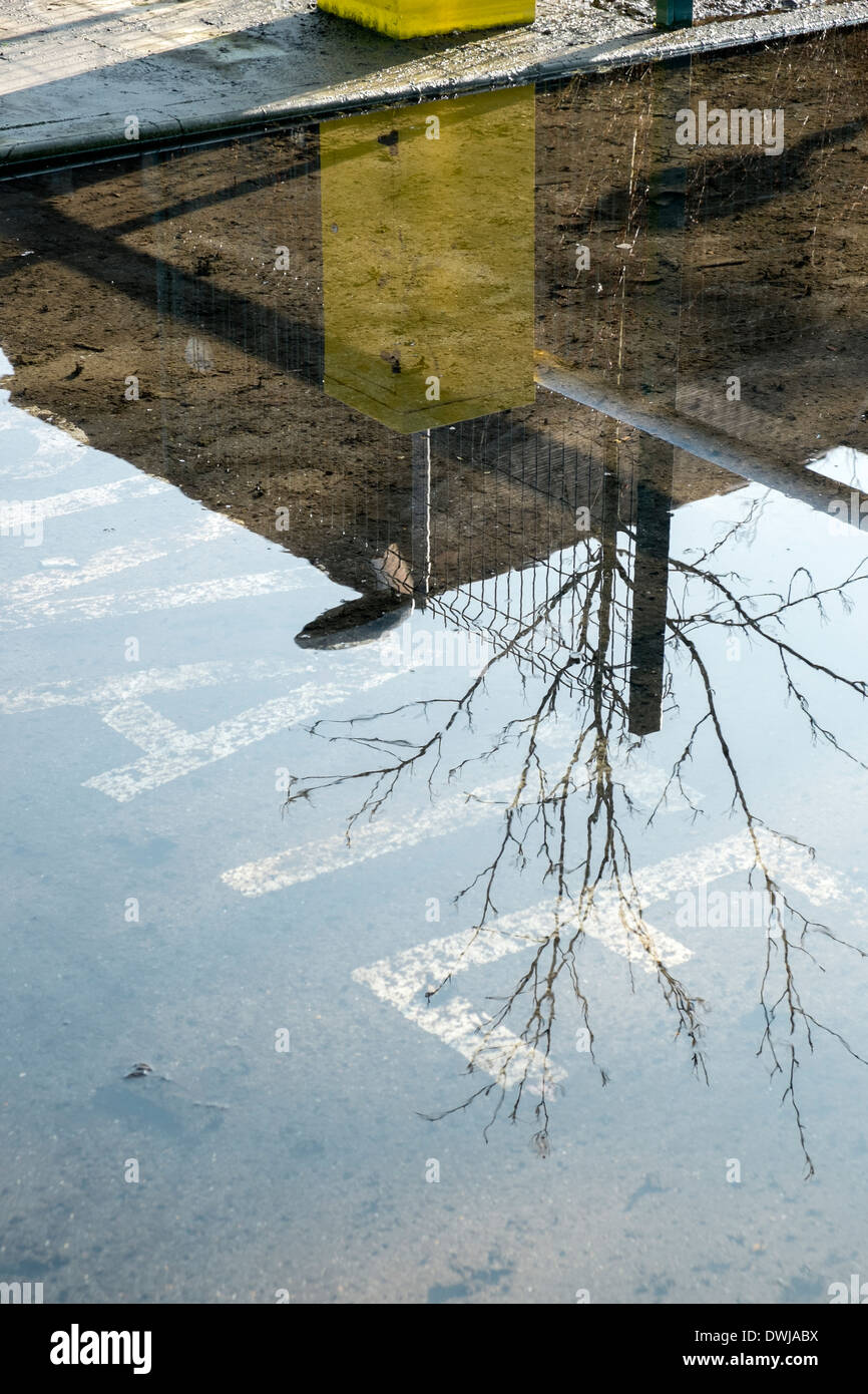 Flood water in Chalfont St Giles public car park Bucks UK Stock Photo