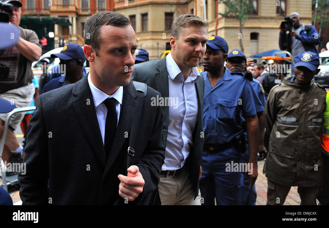 Pretoria, South Africa. 10th Mar, 2014. Oscar Pistorius (L) walks to Pretoria's North Gauteng High Court in Pretoria, South Africa, on March 10, 2014, at the start of the second week Oscar Pistorius' murder trial. Credit:  Philly/Xinhua/Alamy Live News Stock Photo