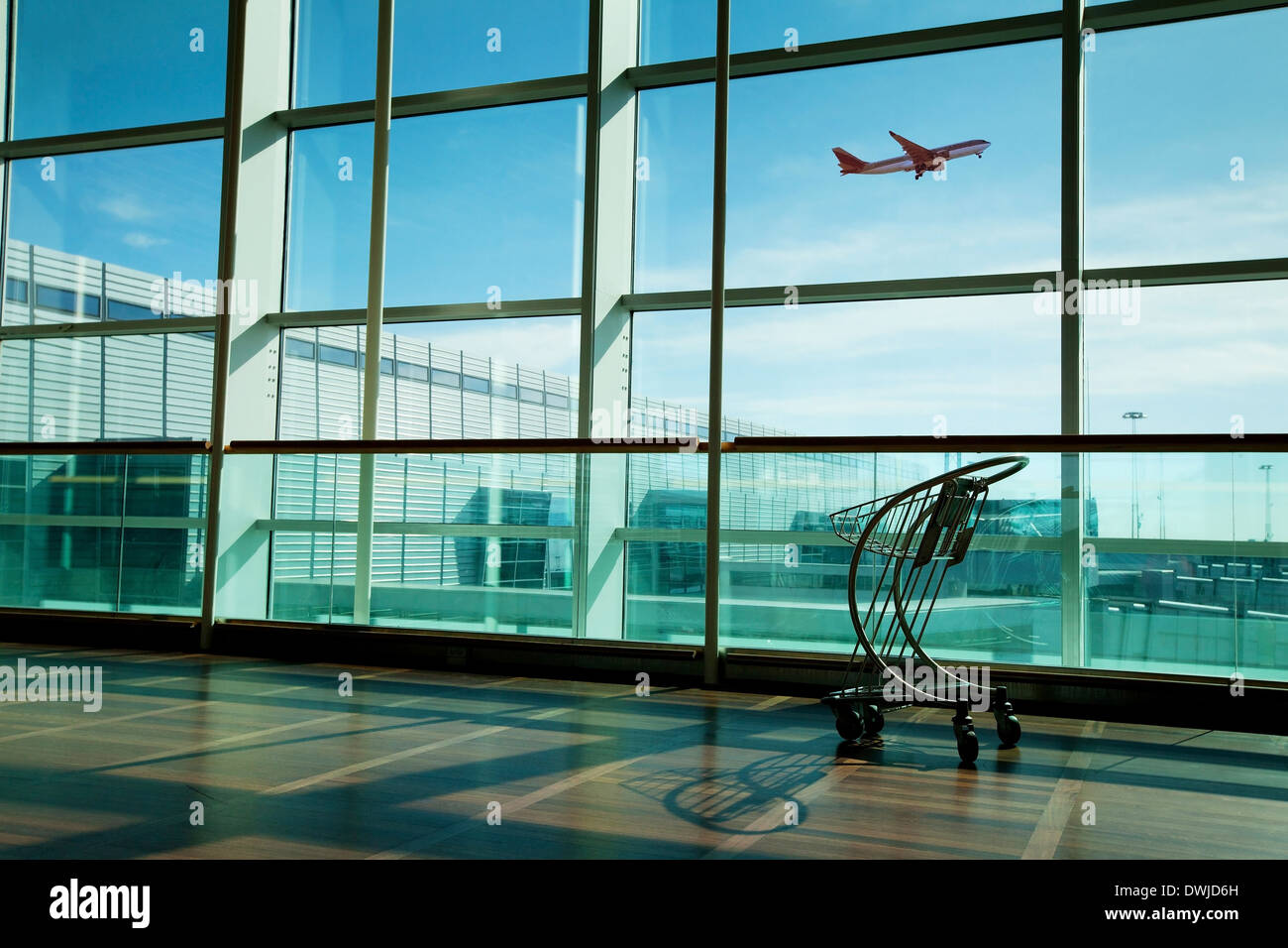 luggage cart in airport interior Stock Photo