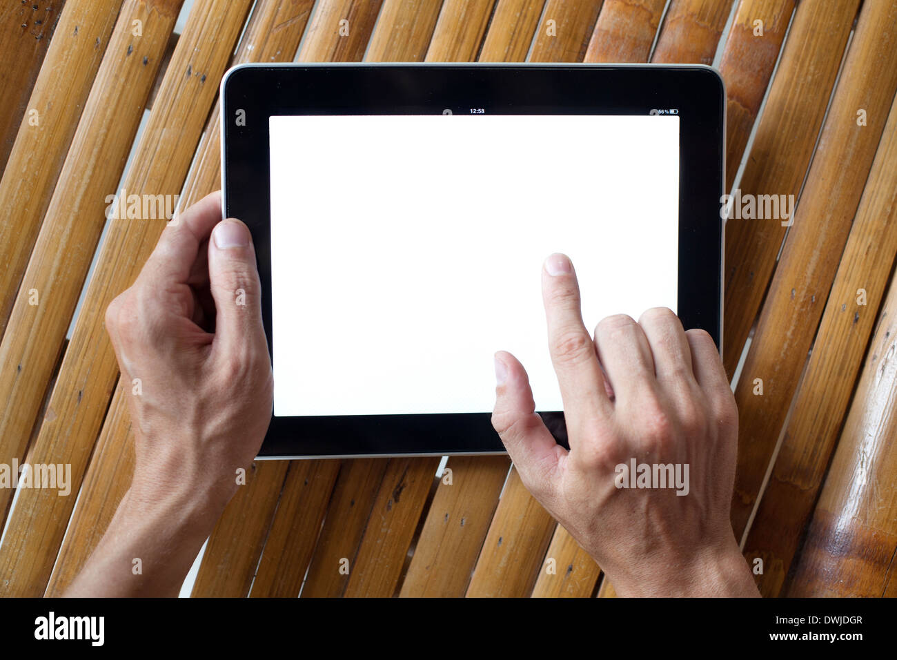 hands holding tablet Stock Photo