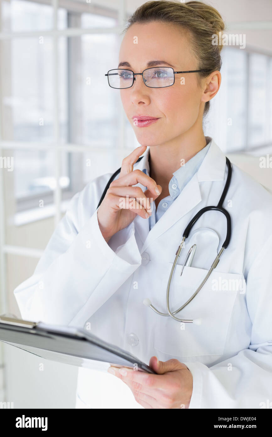 Thoughtful female doctor hi-res stock photography and images - Alamy