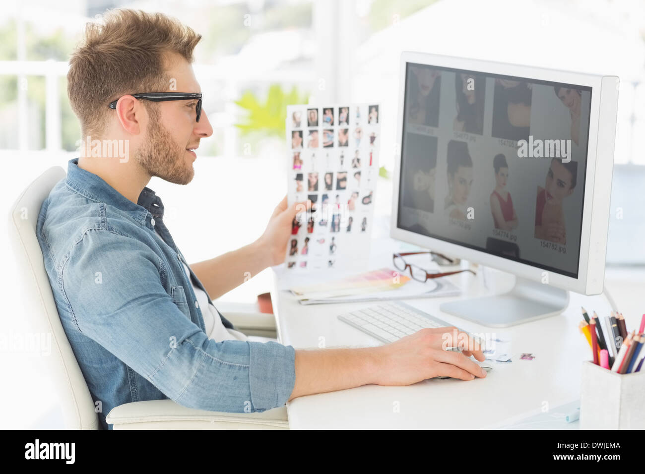 Editor Worker Computer Handsome editor working at his computer Stock Photo - Alamy