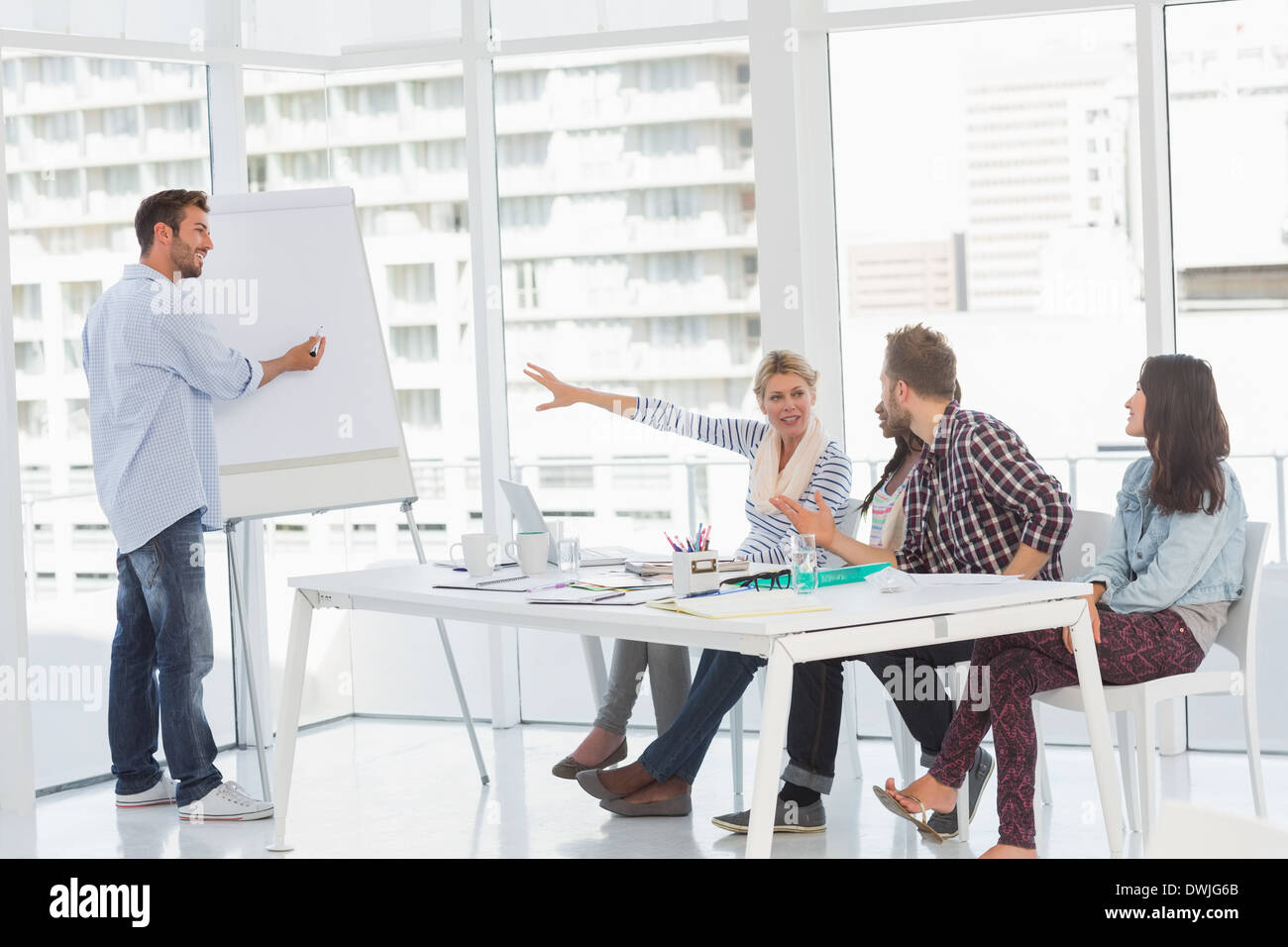 Man presenting an idea to his colleagues Stock Photo