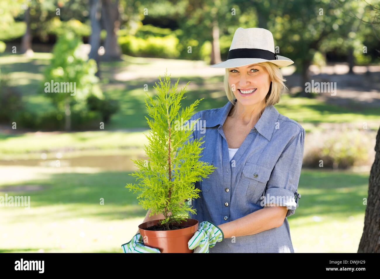 Mature woman potted plant hi-res stock photography and images - Alamy