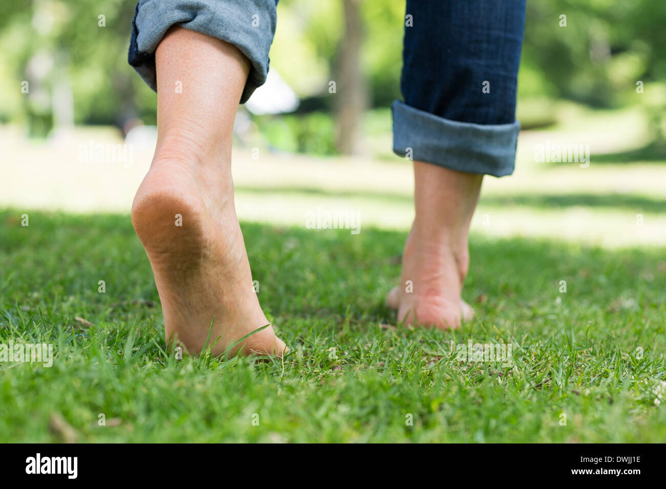 Woman barefoot close up grass hi-res stock photography and images - Alamy