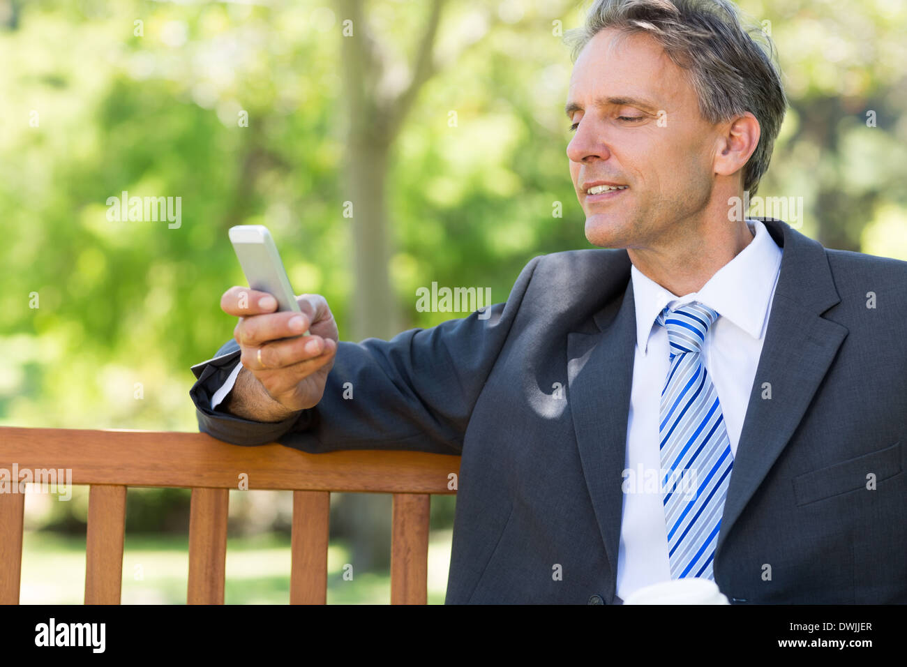 Businessman using smartphone Stock Photo
