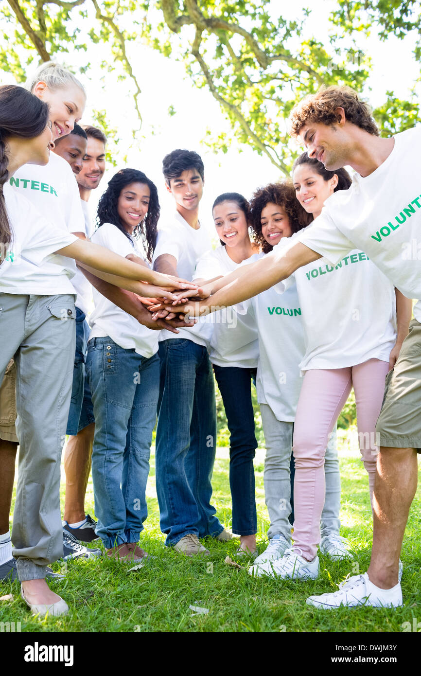 Group of multiethnic environmentalists stacking hands in park Stock ...