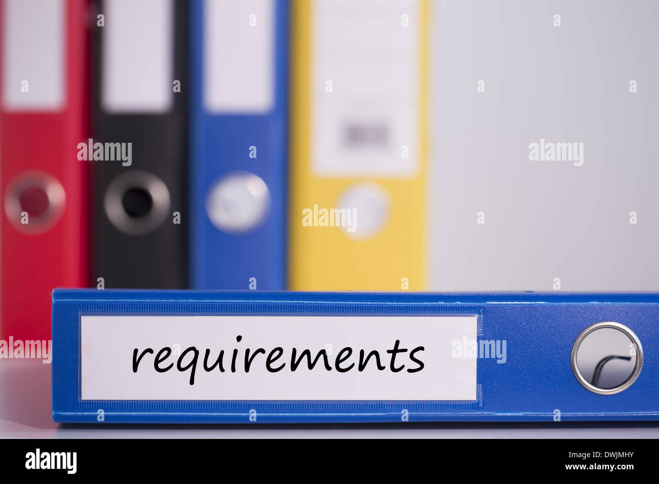 Requirements on blue business binder Stock Photo