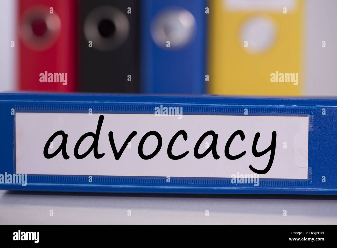 Advocacy on blue business binder Stock Photo