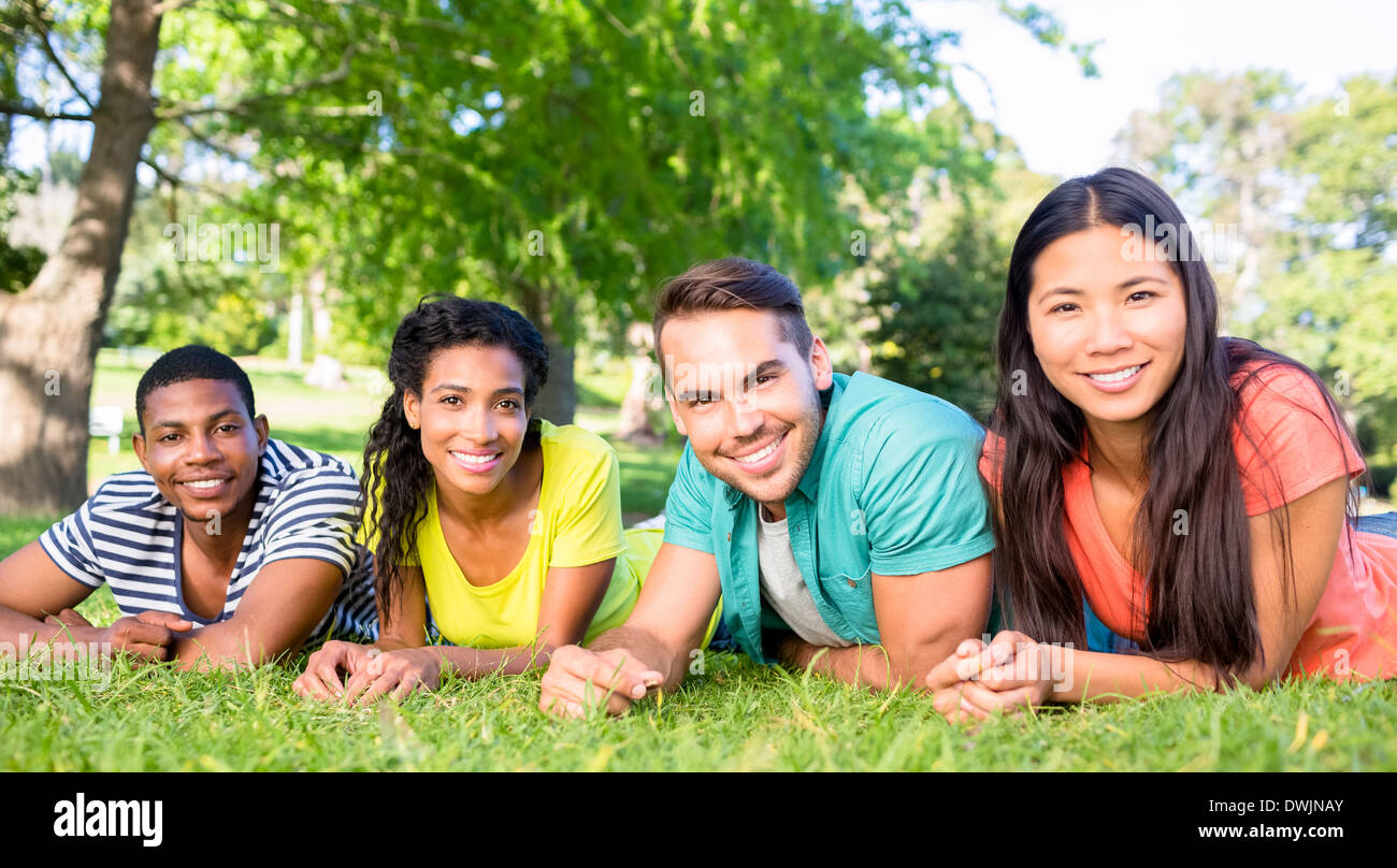 Friends lying at college campus Stock Photo