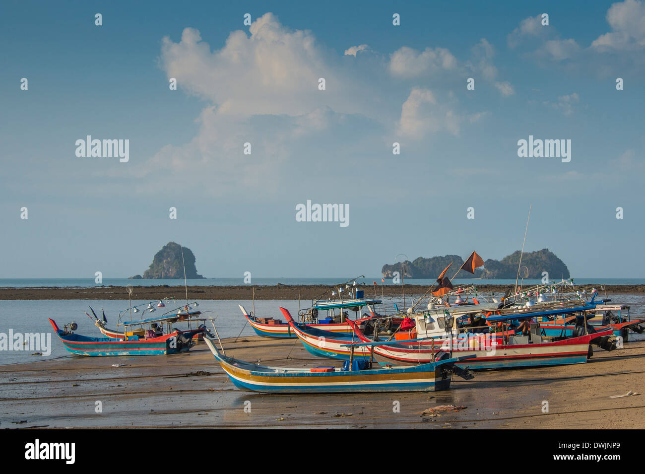 Fishing boat with black flags on the beach on a rainy day