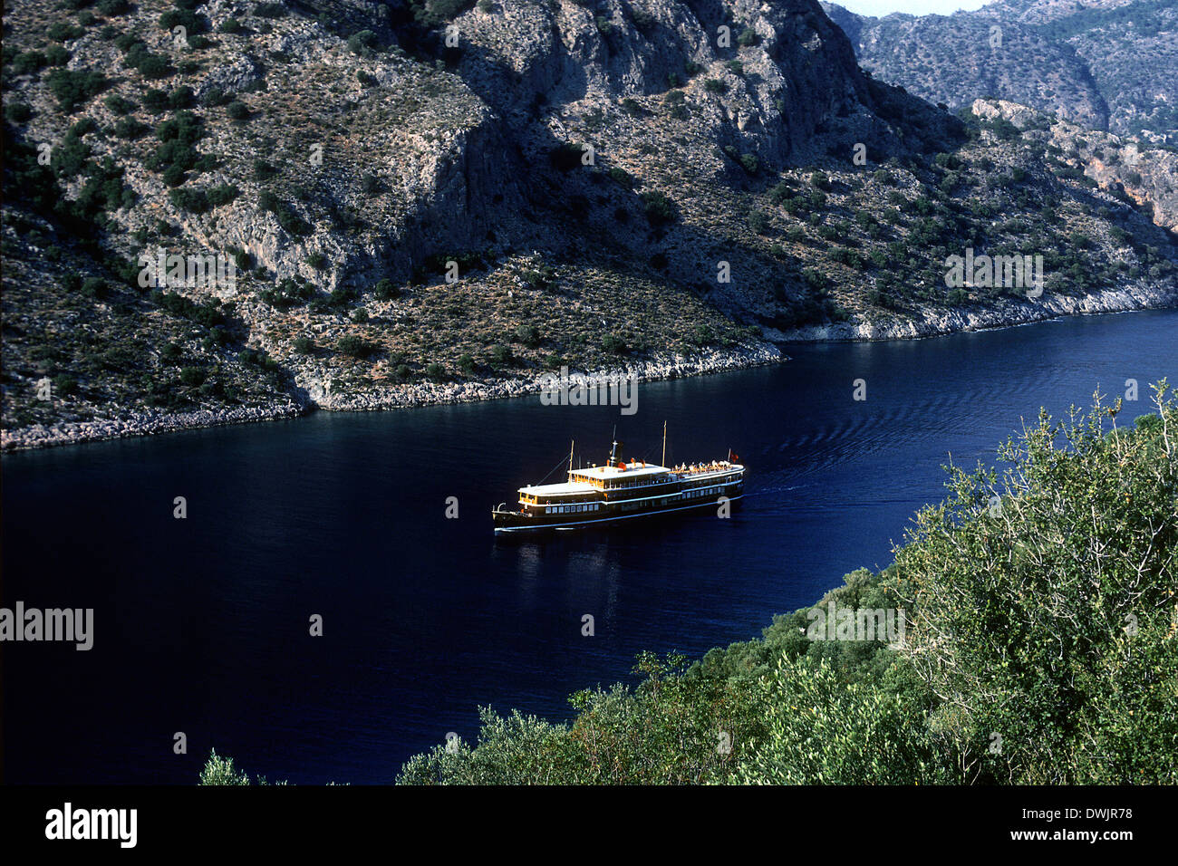 Halas, a renovated steam boat, and now a small luxury cruise boat off the Turquoise Coast in Turkey, near Gocek. Stock Photo