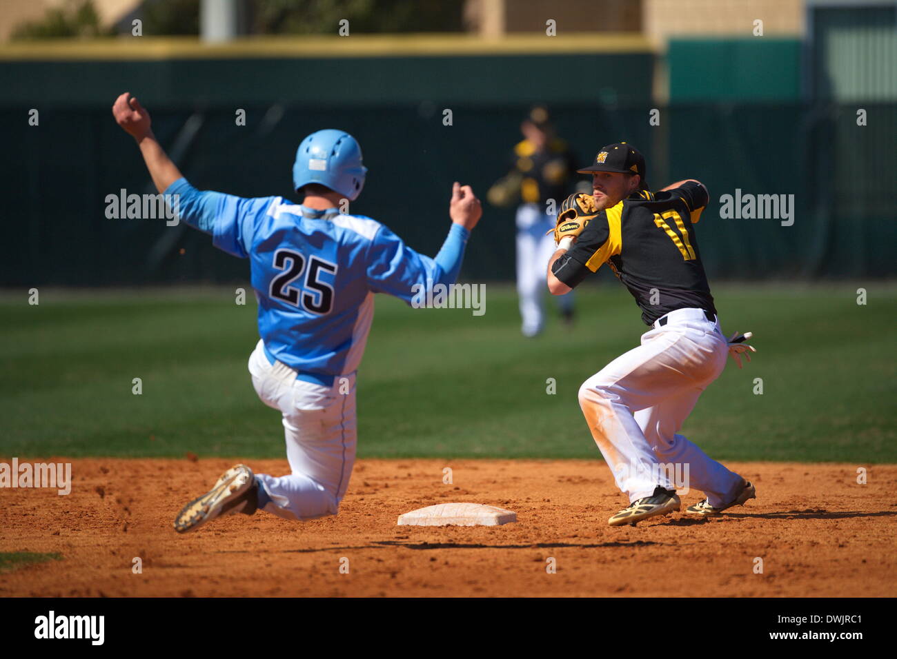 Kennesaw, Georgia, USA.  March 8, 2014 -- Second Baseman Dylan Ivey (17) turns a doubleplay during the first game of Saturday's doubleheader between Columbia University and Kennesaw State University. The teams split the doubleheader. Credit:  Wayne Hughes | Alamy Live News Stock Photo