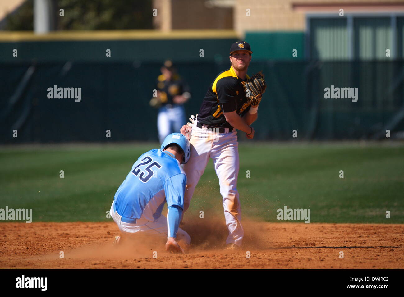 Kennesaw, Georgia, USA.  March 8, 2014 -- Second Baseman Dylan Ivey (17) turns a doubleplay during the first game of Saturday's doubleheader between Columbia University and Kennesaw State University. The teams split the doubleheader. Credit:  Wayne Hughes | Alamy Live News Stock Photo