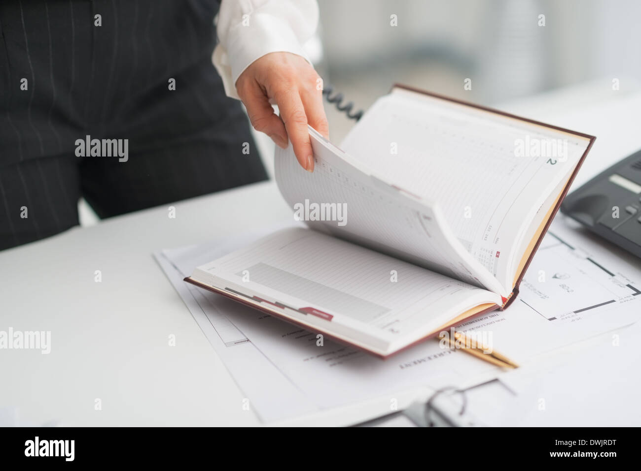 Checking Notepad Career woman checking diary hi-res stock photography and images - Alamy