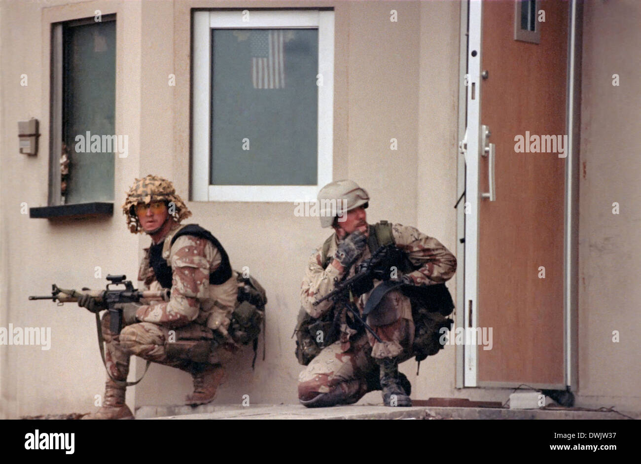 US Navy SEAL commandos arrive at the US Embassy in Kuwait City in a Desert Patrol Vehicle during the liberation of Kuwait City in the Gulf War February 26, 1991 in Southern Iraq. Stock Photo