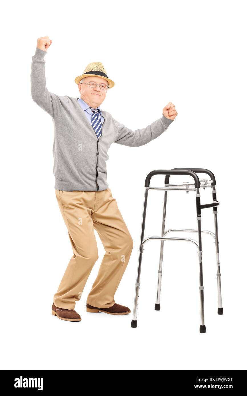 Full length portrait of an old man with a walker raising 