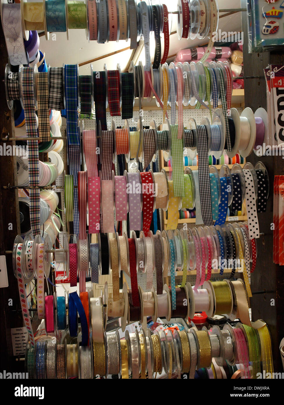 Dressmakers ribbons for sale in the Pannier Market, Truro, Cornwall, UK Stock Photo