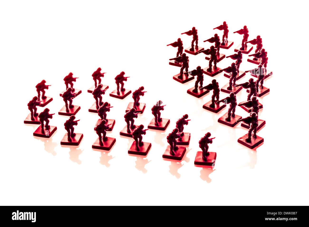 Plastic soldiers forming a heart split in two, on white background. Stock Photo
