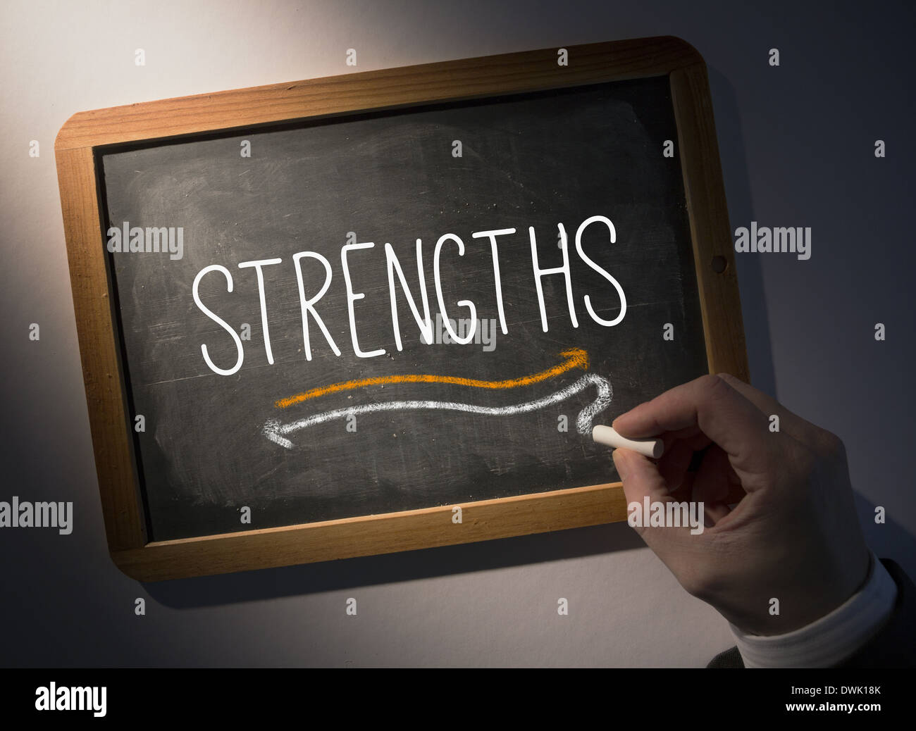 Hand writing Strengths on chalkboard Stock Photo