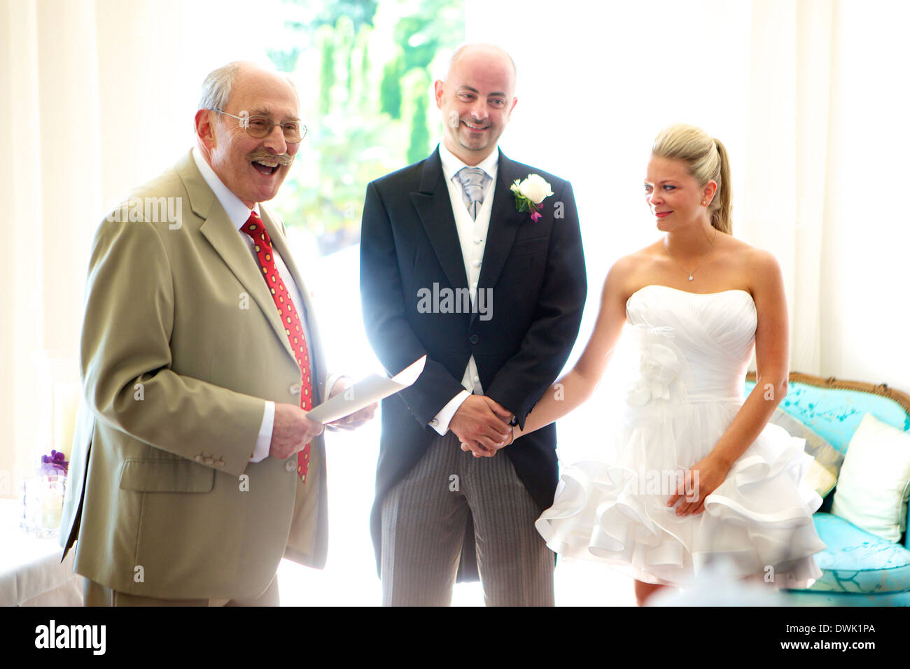 Bride and groom getting married with a registrar in attendance Stock Photo