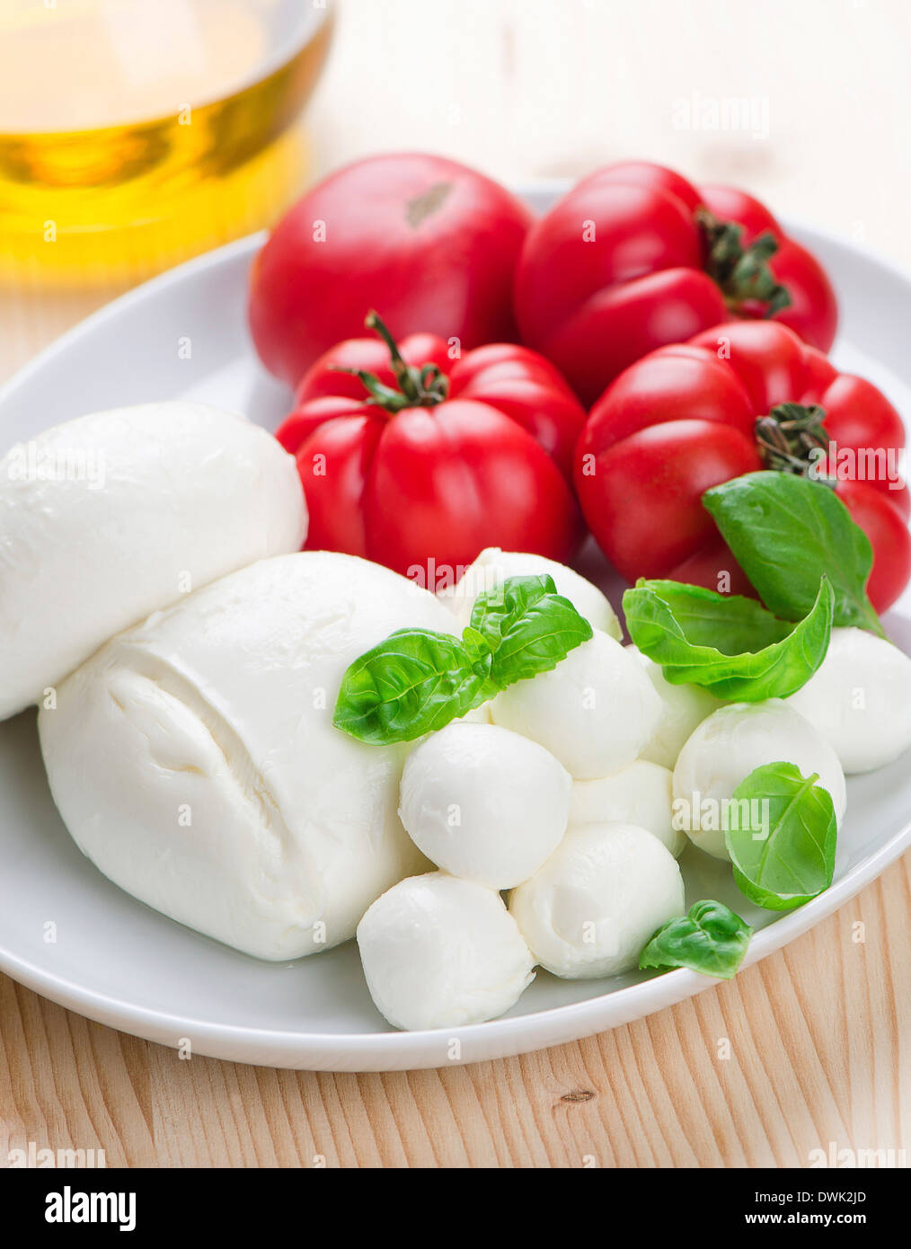 Mozzarella Cheese with Tomato and Basil Stock Photo