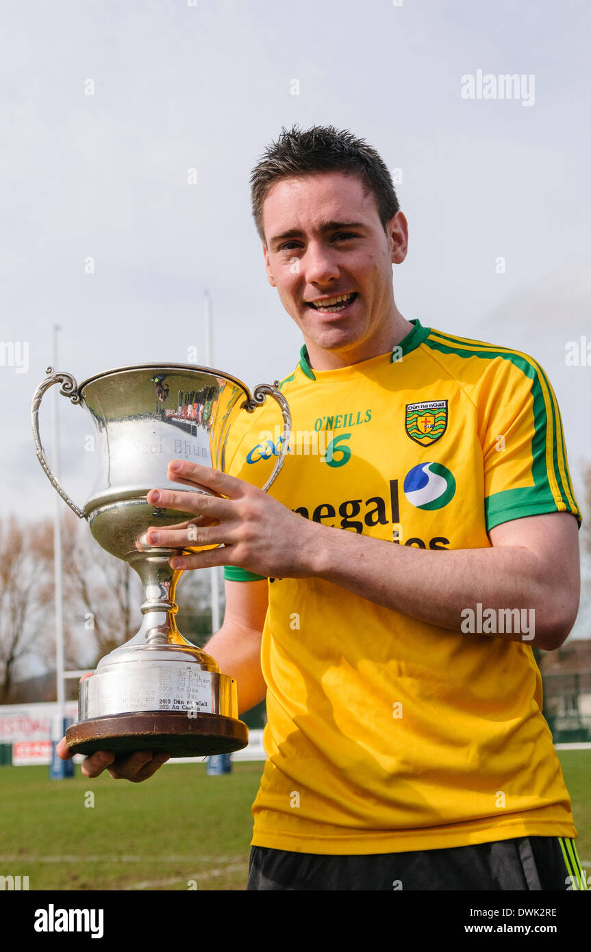 Belfast, Northern Ireland. 10 Mar 2014 - A Donegal player holds up the Cadburys Ulster Under 21 Football Championship Cup Credit:  Stephen Barnes/Alamy Live News Stock Photo