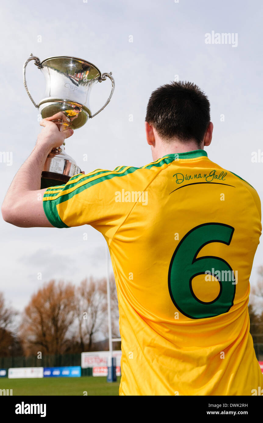 Belfast, Northern Ireland. 10 Mar 2014 - A Donegal player holds up the Cadburys Ulster Under 21 Football Championship Cup Credit:  Stephen Barnes/Alamy Live News Stock Photo