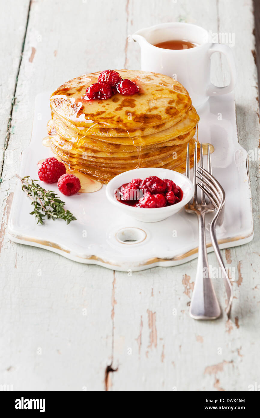 Small pancakes topped with raspberries Stock Photo