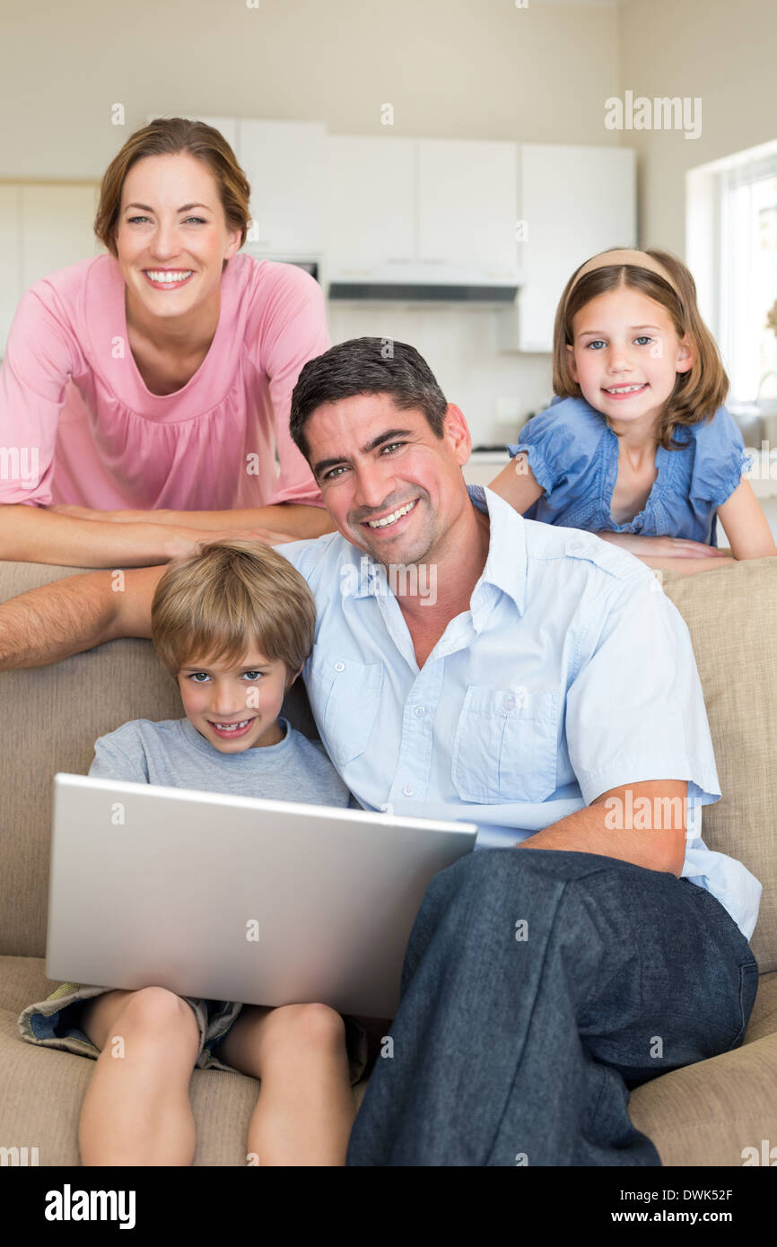 Family using laptop together Stock Photo - Alamy