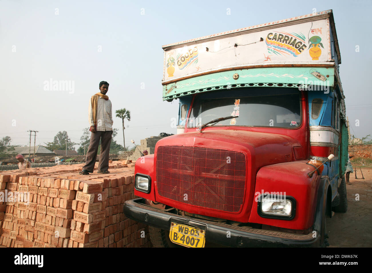 Brick field workers carrying complete finish brick from the kiln, and