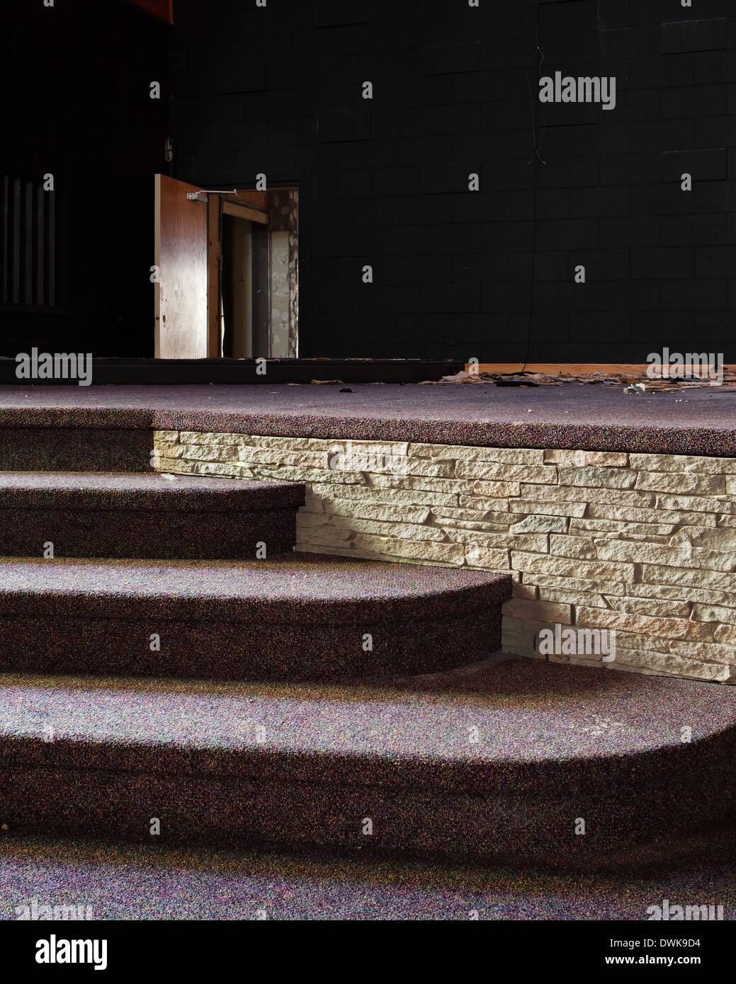 Detail shot of stairs and a doorway in the sanctuary of an abandoned church. Harvest Bible Chapel, Oakville, Ontario, Canada. Stock Photo