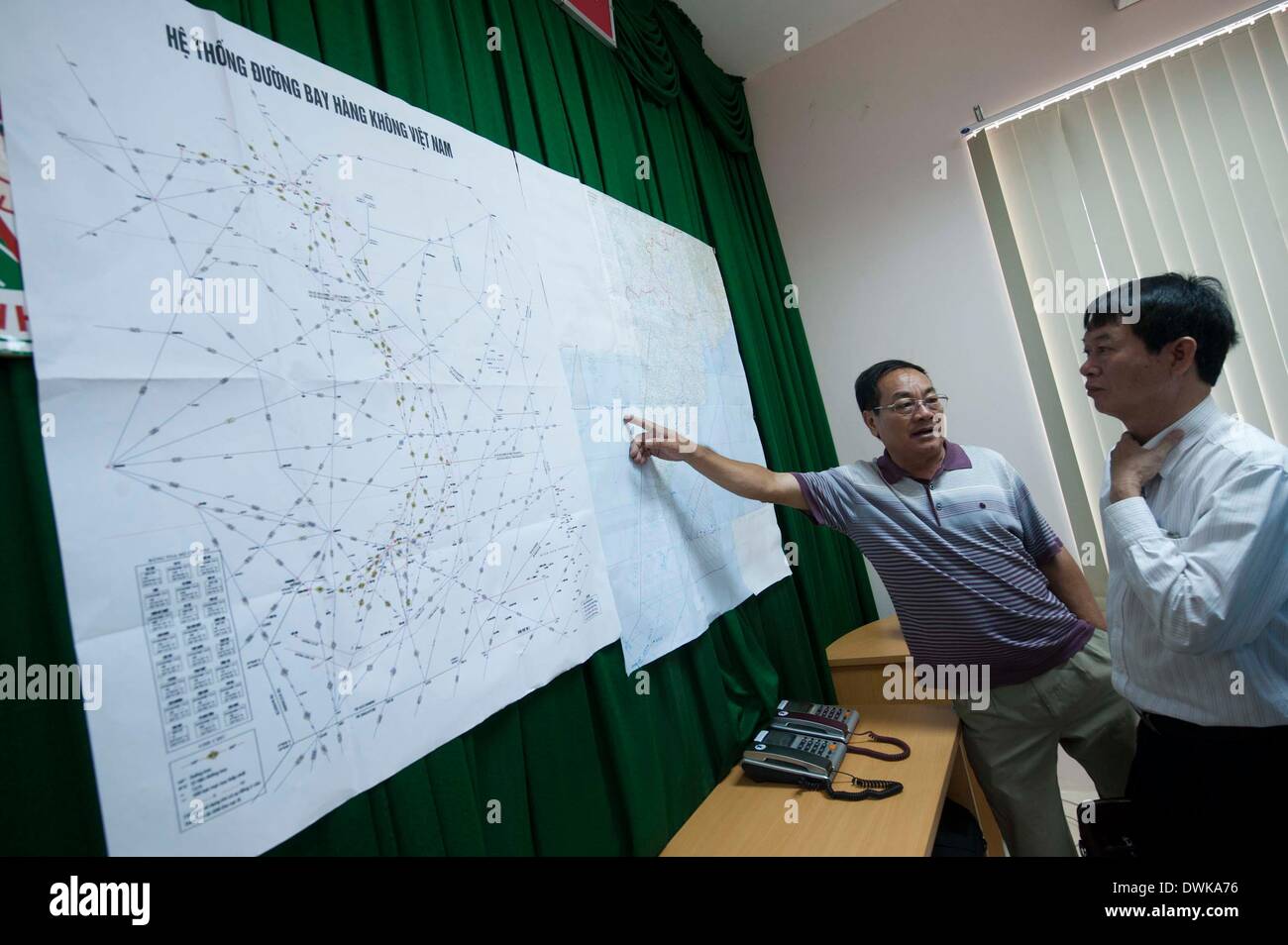 Phu Quoc Island, Vietnam. 11th Mar, 2014. Staff members work at the rescue command office for the missing Malaysia Airlines flight MH370 on Phu Quoc Island, Vietnam, March 11, 2014. Credit:  Lui Sui Wai/Xinhua/Alamy Live News Stock Photo