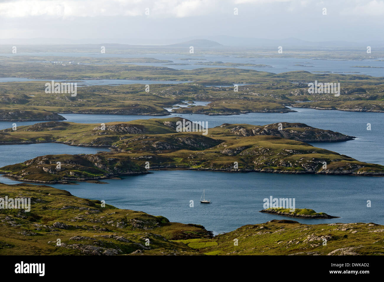The convoluted east coast of South Uist over Loch Skipport, looking towards Benbecula, Western Isles, Scotland, UK Stock Photo