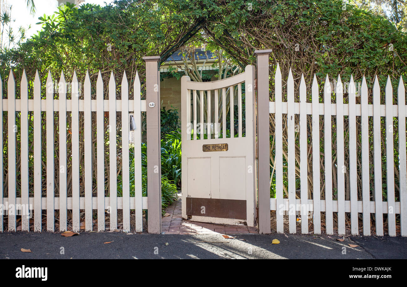 Wooden fence and gate at a house called ' The Retreat' Stock Photo