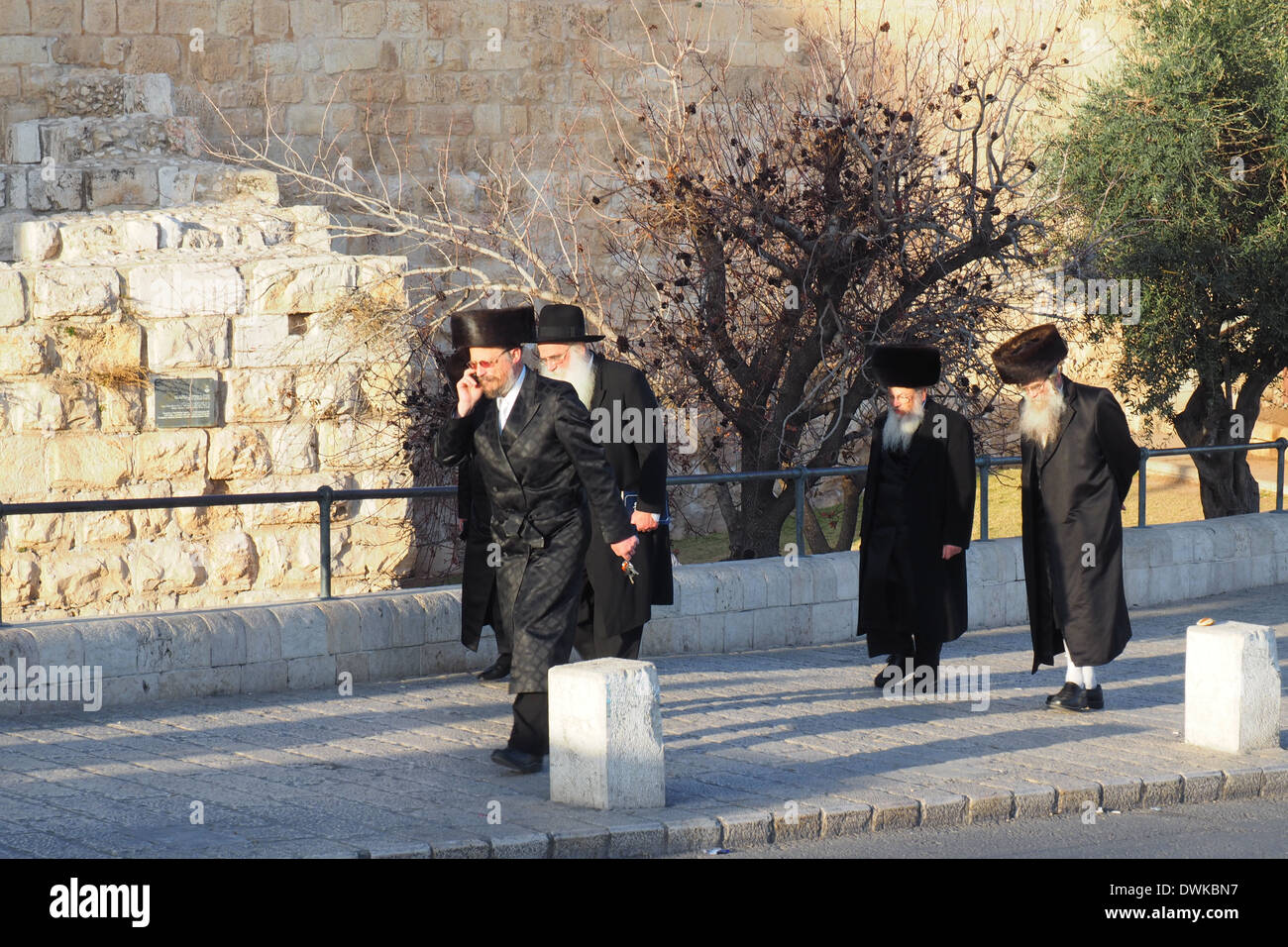 Religious orthodox Israelis  leaving the Old City of Jerusalem before commencement of the sabbath. Stock Photo