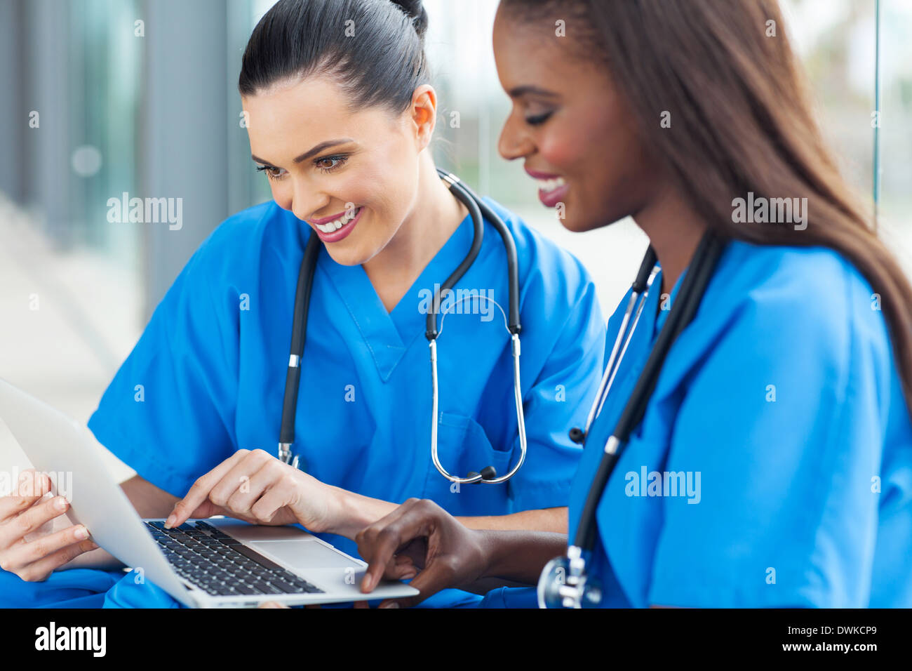happy healthcare workers using laptop Stock Photo