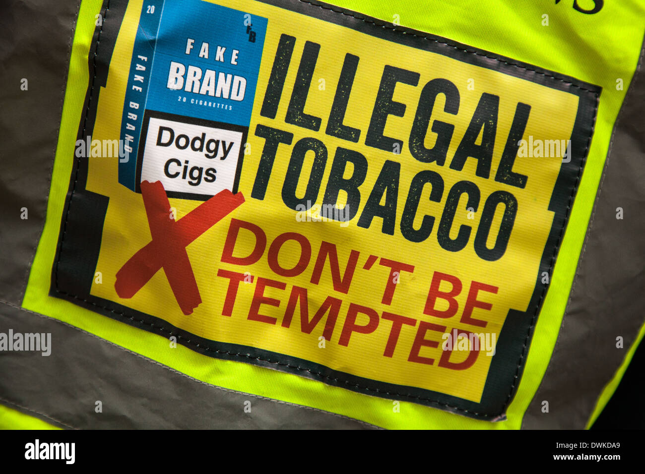 Fake brand Illegal Tobacco - Don't be tempted   Hi-vis shirt to deter the purchase of illegal imports of Dodgy cigs, Manchester City Centre, UK Stock Photo