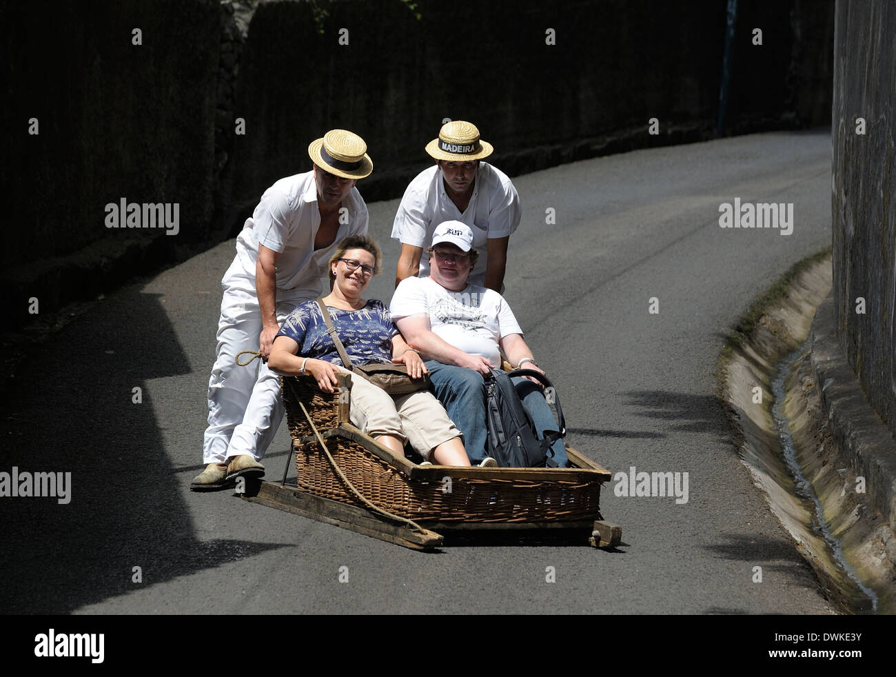 Monte Madeira Portugal,a happy couple enjoying the toboggan ride down the hill to Funchal Stock Photo