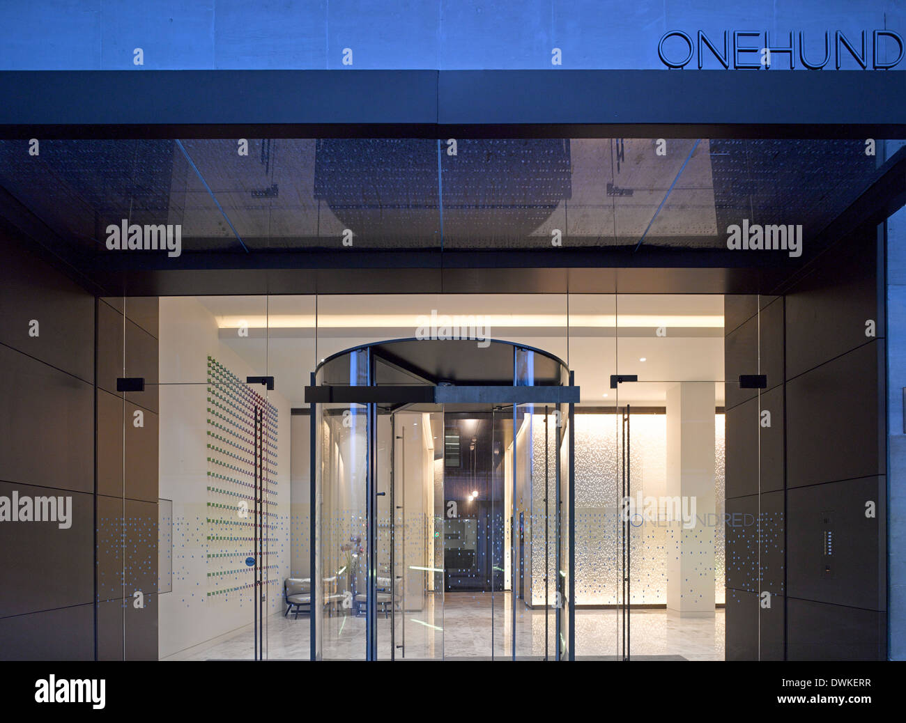 One Hundred New Oxford Street, London, United Kingdom. Architect: Morey Smith, 2013. Dusk view looking into reception. Stock Photo