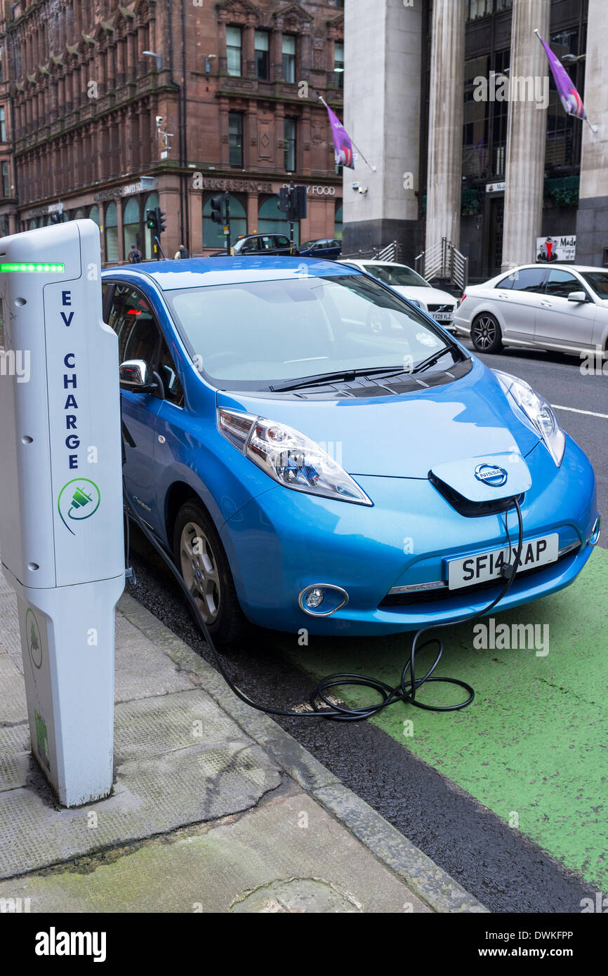 Electric car being recharged from a charging point, Glasgow city centre