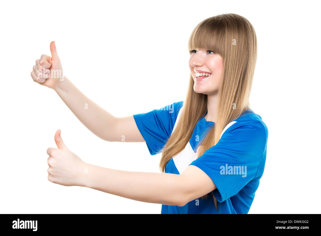 Happy girl in blue soccer shirt is holding her thumbs up Stock Photo
