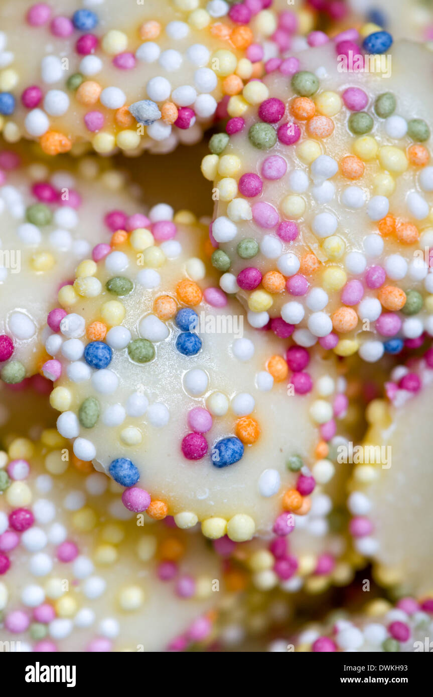 White chocolate buttons with coloured sprinkles or hundreds and thousands Stock Photo