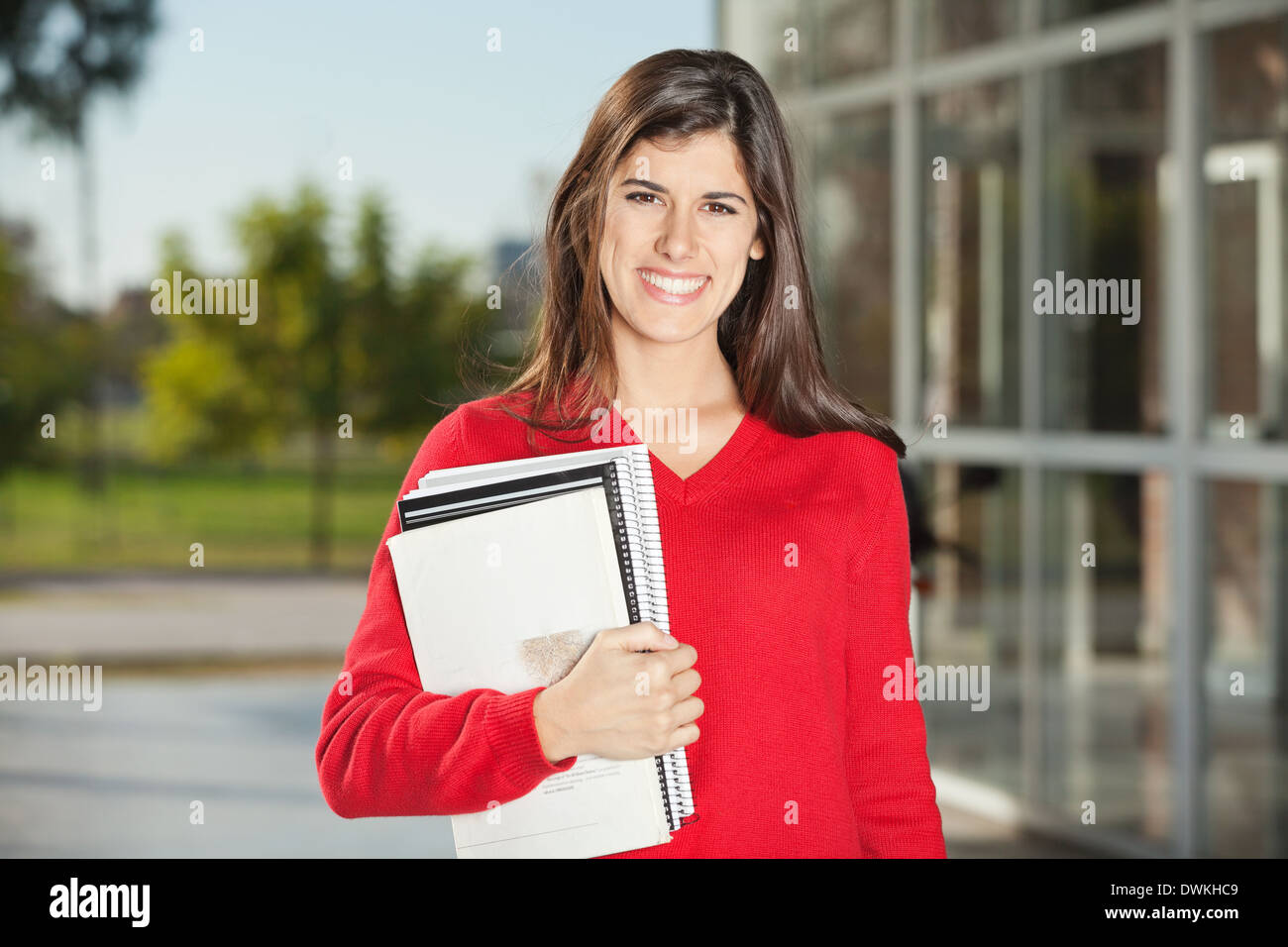 Student With Books Standing On College Campus Stock Photo - Alamy