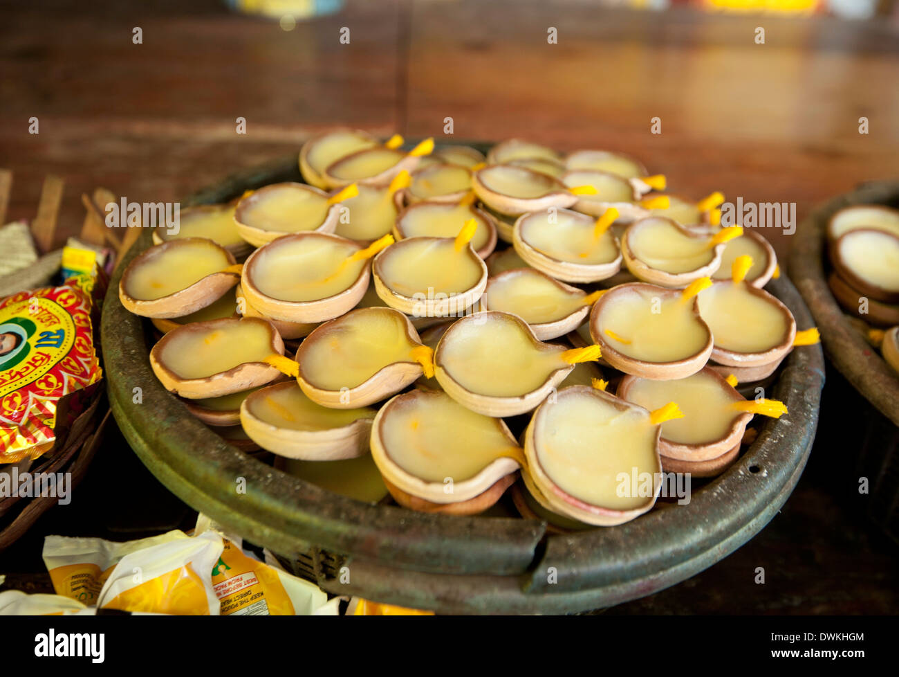Oil and cotton wick diya (puja lamps) in terracotta dishes, at the Bhubaneshwari temple, Nilachal Hill, Guwahati, Assam, India Stock Photo